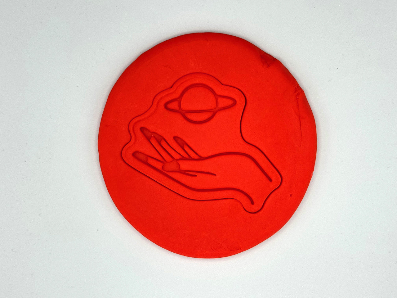 Keksausstecher - Hand mit Planet